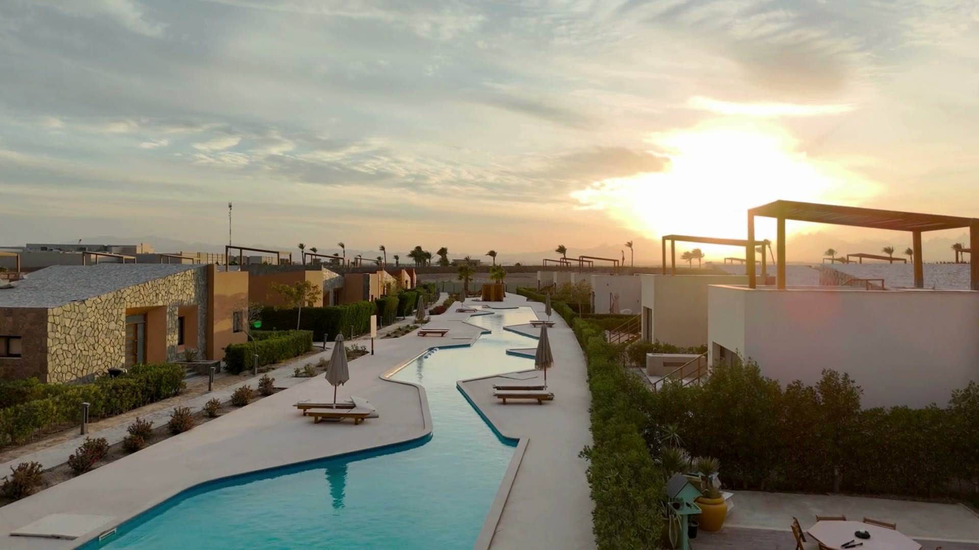 Kamo Property: luxury coastal residences at sunset